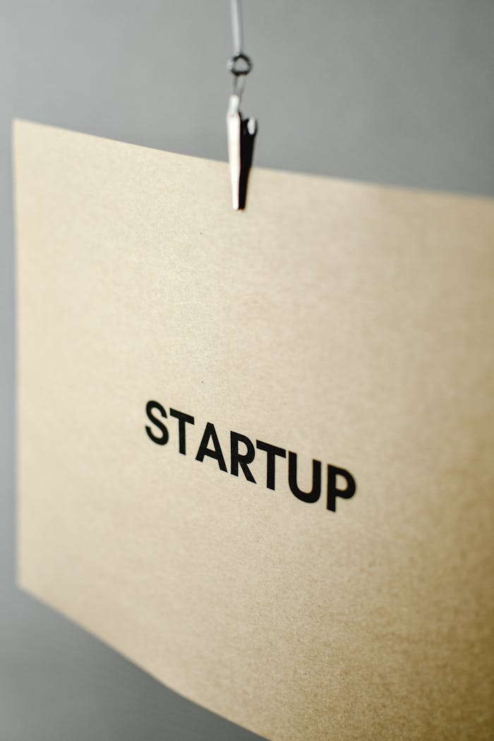 Close-up of a brown paper sign with the word Startup, symbolizing entrepreneurship.